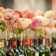 Zinnias in wines bottles, wedding at the Balch Hotel
