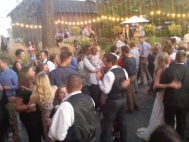 Wedding party dancing on the patio, Balch Hotel
